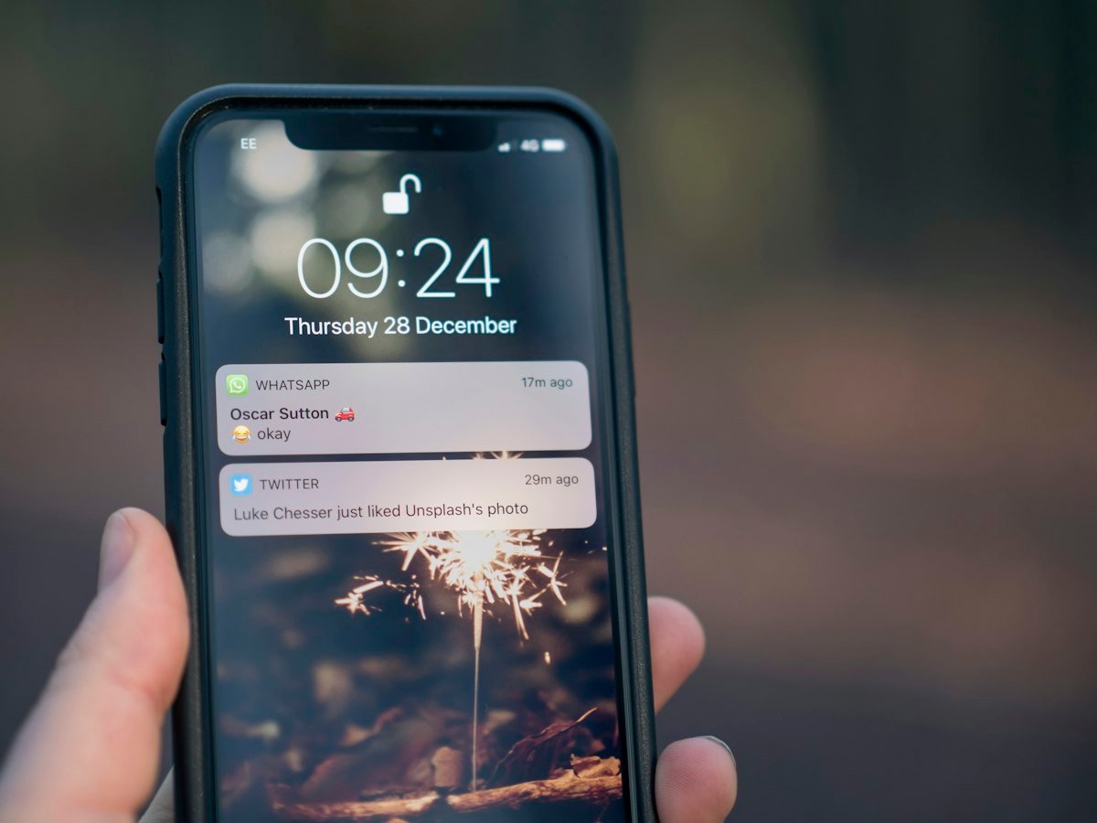 Checking the Fiverr app on a phone to reply to buyers quickly