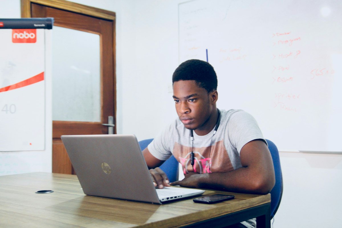 Young student working on a laptop to start freelancing in Pakistan