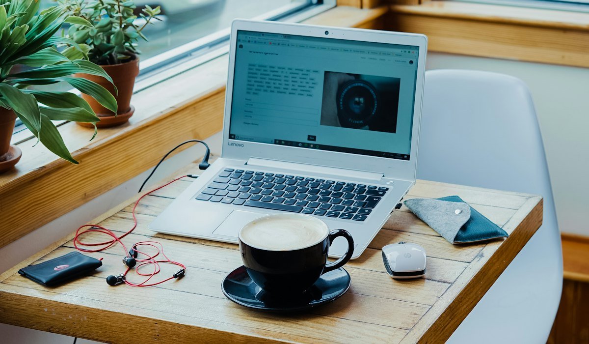 Laptop on a desk while reviewing common Upwork proposal mistakes